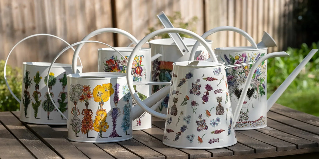 Charlotte Posner artistic watering cans and planters, playful garden accessories with signature artwork