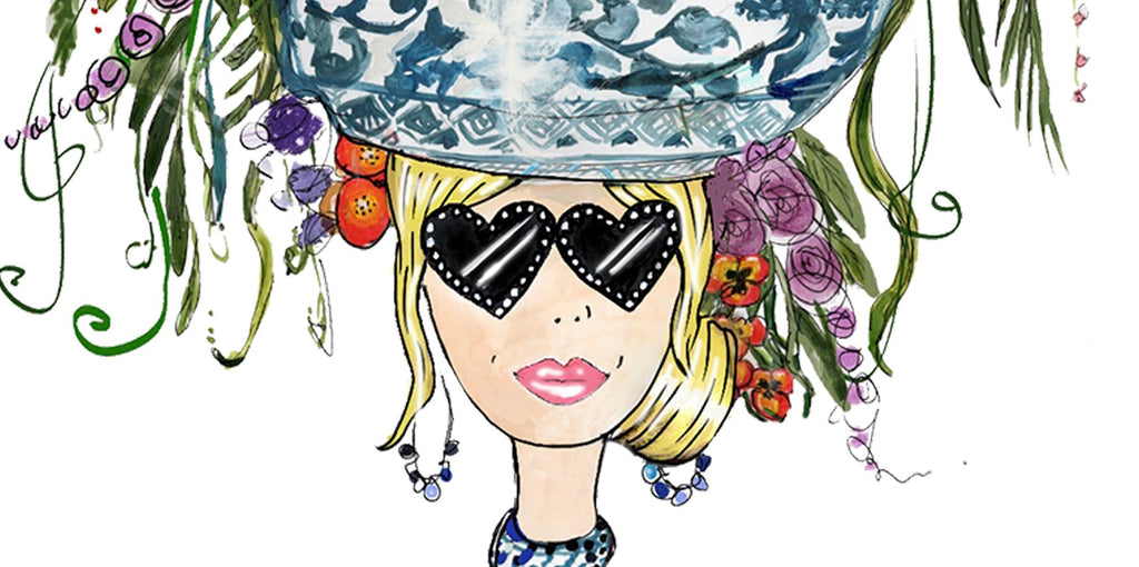 A stylized fashion illustration of a woman with heart-shaped sunglasses, a blue-and-white patterned high-neck top, and a large floral hat arrangement in vivid colors, holding a cup on a white background.